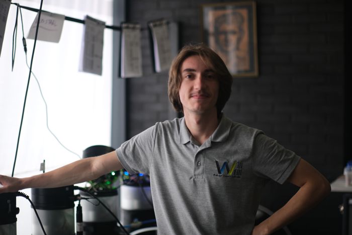 Will-Fill team member testing a device on a CNC machine tank
